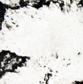 Close-up of white powder on a black background